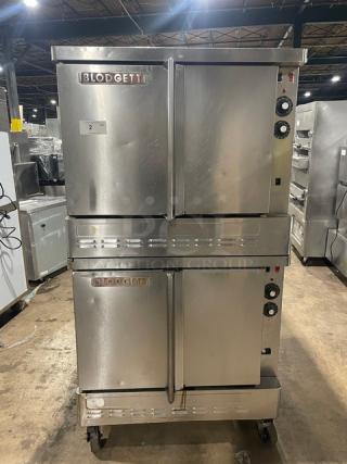 Blodgett stainless steel double stacked gas convection oven, includes wired oven rack, on casters, in good condition.