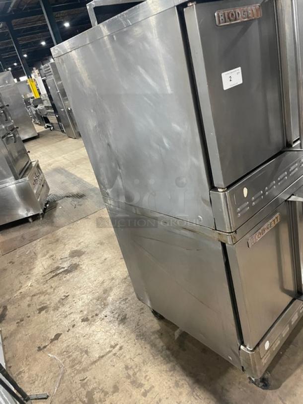 Blodgett commercial stainless steel double convection oven, gas-powered, with wired rack, on casters, used condition.