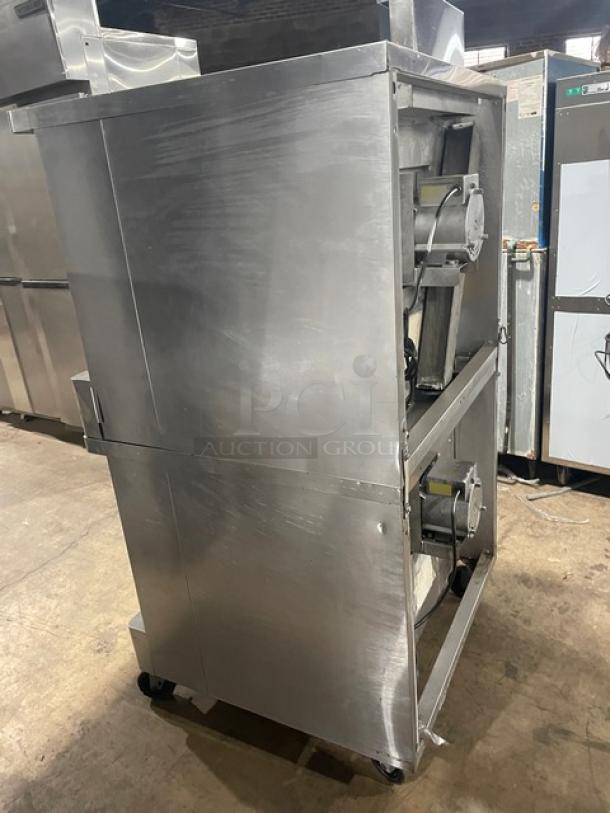 Blodgett commercial stainless steel double stacked gas convection oven on casters, includes wired oven rack, side view.