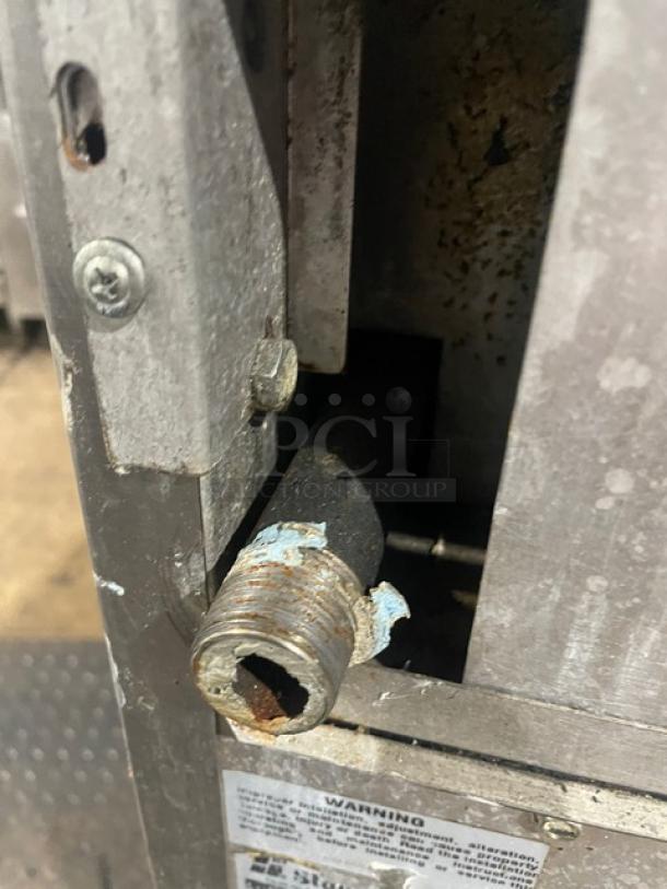 Bakers Pride commercial gas 10-burner range, double oven combo, stainless steel, with backsplash, salamander shelf.