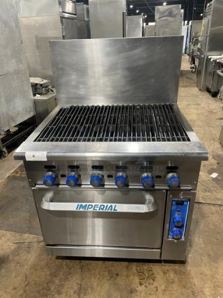Imperial commercial stainless steel gas char broiler and convection oven combo with backsplash, wired oven rack, on casters.