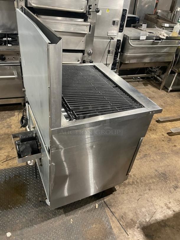 Imperial commercial stainless steel gas radiant char broiler and convection oven combo with backsplash and wired oven rack.