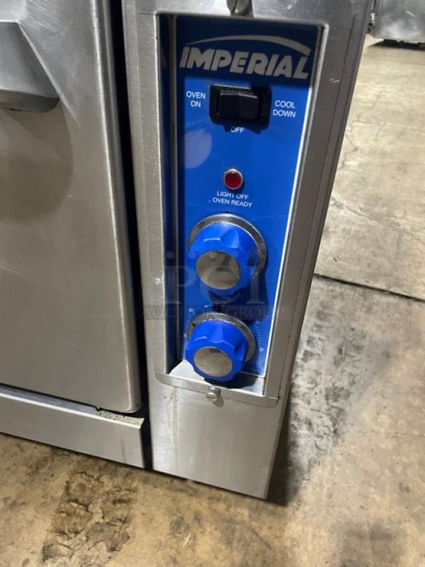 Imperial commercial stainless steel gas char broiler and convection oven combo with control panel, blue knobs, and branding.