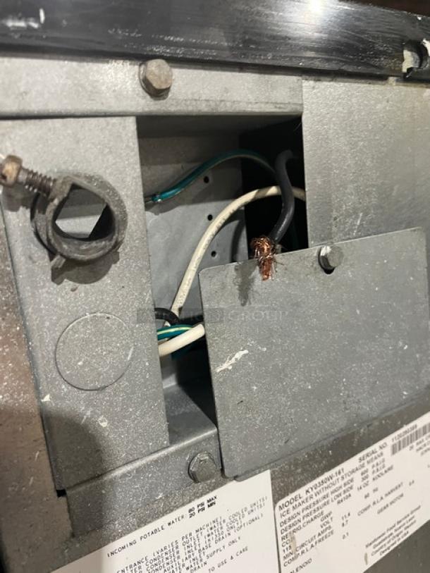 Manitowoc Koolaire KY0350W-161 ice machine, stainless steel, electric-powered, 115V, auction item, visible wiring.