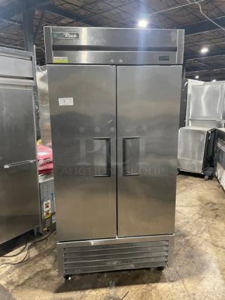 True T-35-HC commercial stainless steel 2-door reach-in refrigerator with wired rack, on casters, model T35HC.