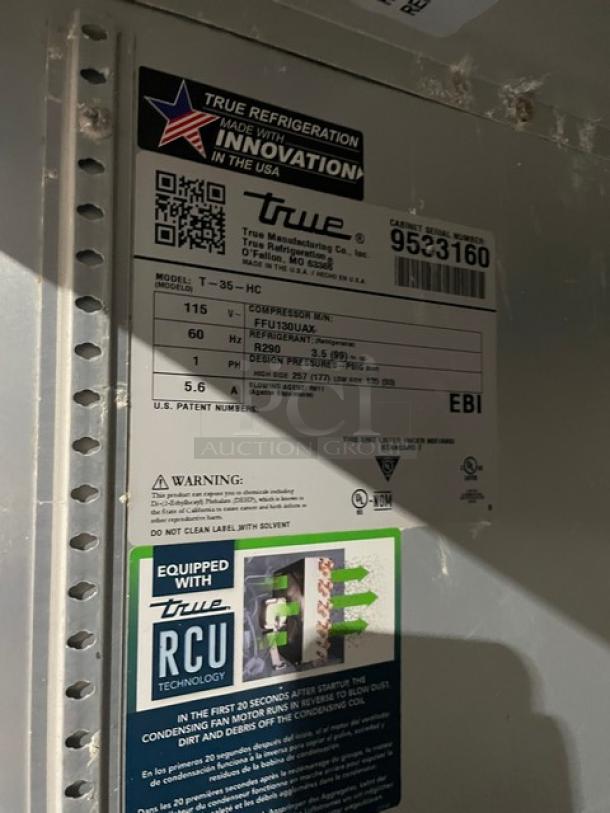 True T-35-HC stainless steel 2-door reach-in refrigerator, model T35HC, SN 9533160, with wired rack, 115V, 1 phase, on casters.