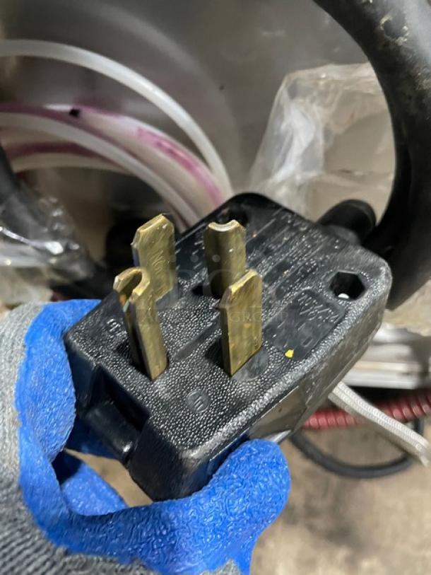 Hobart LXEC Advansys commercial dishwasher power plug close-up, showing three-prong configuration.