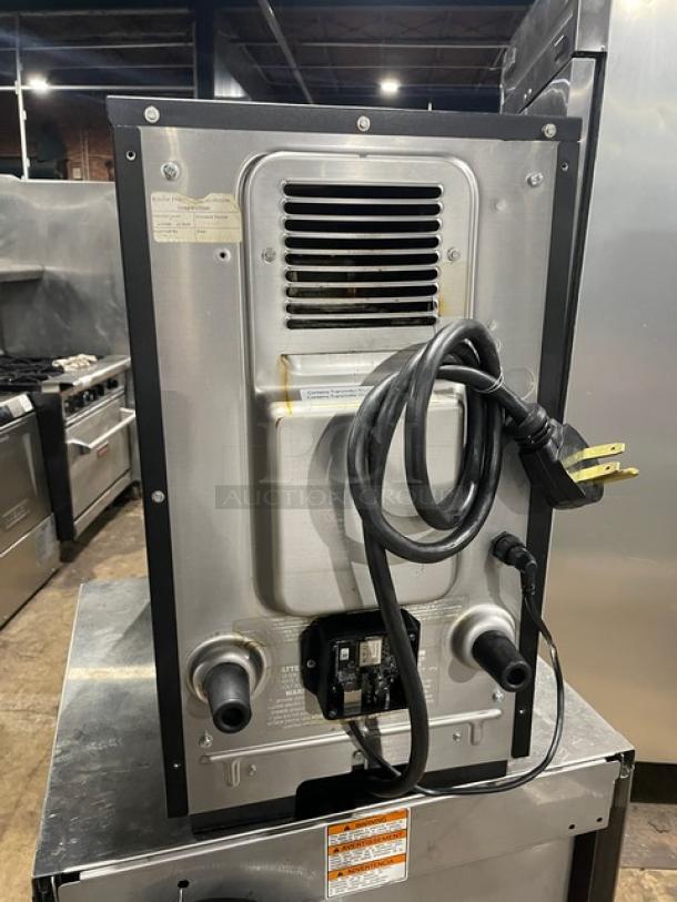 MerryChef black electric countertop high-speed rapid cook oven, rear view showing power cord and ventilation.