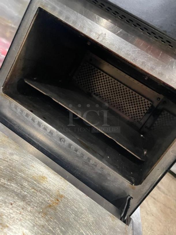 MerryChef commercial black electric countertop rapid cook oven, stainless steel interior, visible light wear, no tags visible.