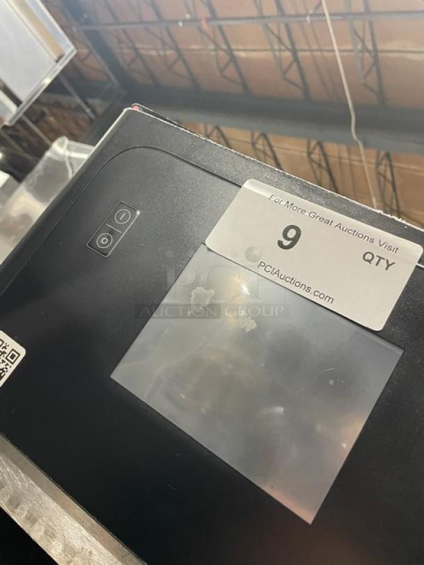 MerryChef commercial electric countertop high-speed oven, black, touchscreen interface. Minor wear visible on screen.