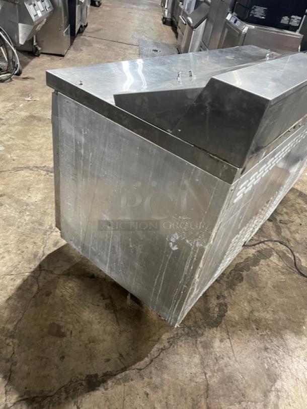 Continental SW72-18 stainless steel 3-door refrigerated prep table, 72" with poly coated wired rack, on casters.