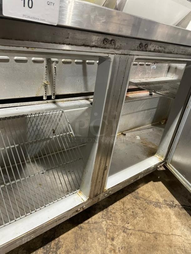 Continental stainless steel 3-door refrigerated bain-marie prep table, model SW72-18, with poly-coated wire racks. On casters.