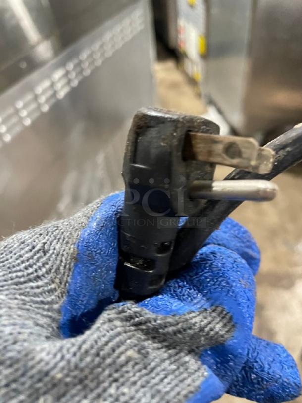 Continental SW72-18 refrigerated prep table, stainless steel, 3-door, 72", bain marie style, on casters, power plug shown.