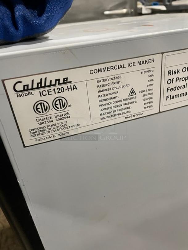 Coldline ICE120-HA commercial ice maker, stainless steel, 2020 model, 115V, working condition, on legs, ETL certified label visible.