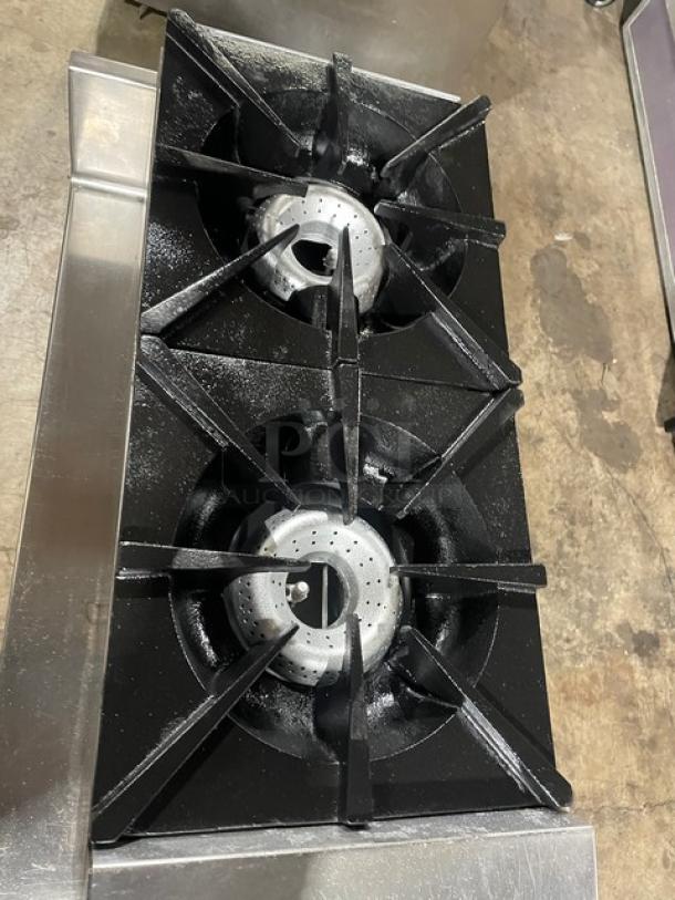 American Range stainless steel double stock pot gas range with front-to-back burners and undershelf equipment stand.