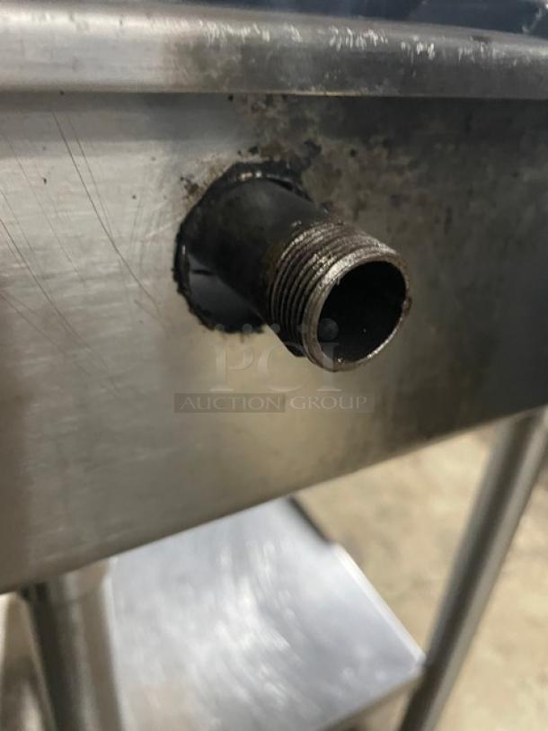 American Range stainless steel gas stock pot range with front-to-back burners and undershelf stand. Slight wear visible.