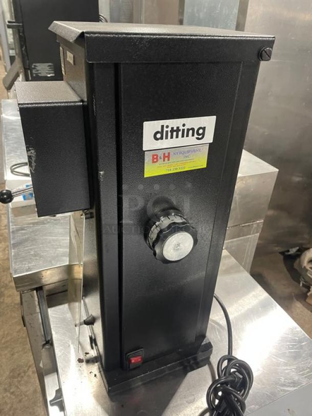 Ditting black electric countertop coffee bean grinder, commercial model. Features include manual knob, visible branding, and power cord.