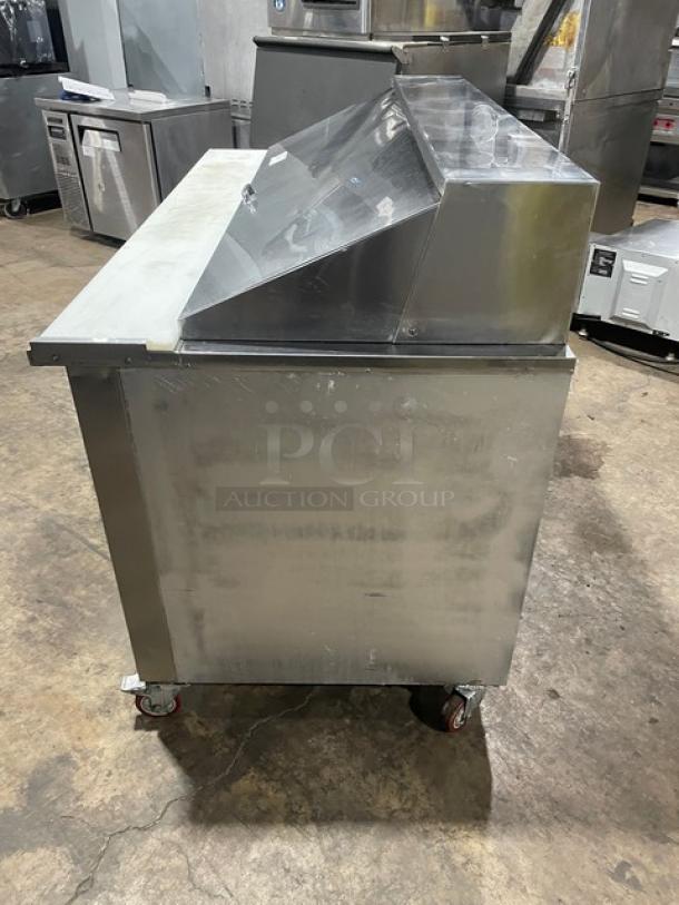 CoolTech stainless steel prep table, model CMPH-60BM, with 2 refrigerated doors, poly-coated rack, on casters.