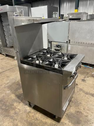 Southbend S241E stainless steel 4-burner range/oven combo with backsplash, salamander shelf, and wired oven rack. On casters.