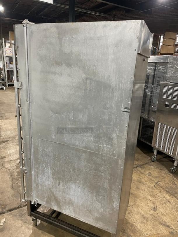 Attias commercial stainless steel full-height gas rotisserie cabinet on casters, shows wear, ideal for professional kitchens.