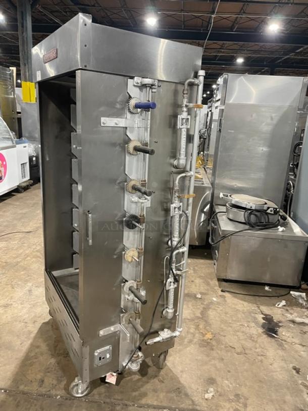 Attias commercial stainless steel gas rotisserie cabinet, full-height, free-standing on casters, featuring multiple spits.
