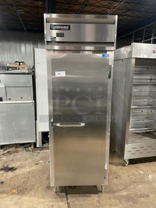 Continental DL1RE-PT stainless steel single door pass-thru refrigerator, with built-in pan slide and on legs, 115V, 1 phase.
