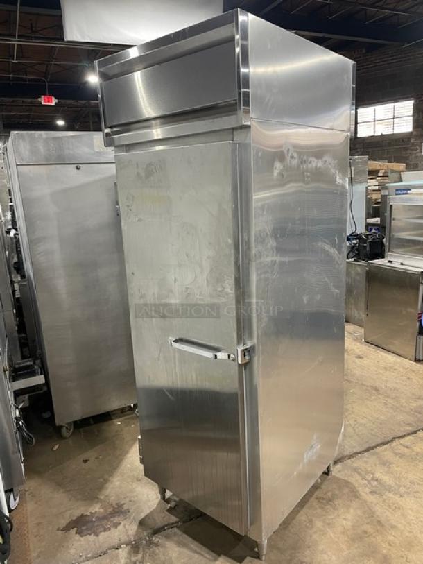 Continental Designer Line DL1RE-PT commercial stainless steel single door pass-thru refrigerator, with built-in pan slide, on legs.