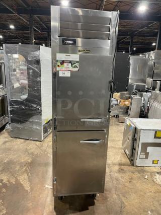 Traulsen commercial stainless steel half-door refrigerator, Model AHT132DUTHHS, with wired racks, on casters, 115V 1 Phase.