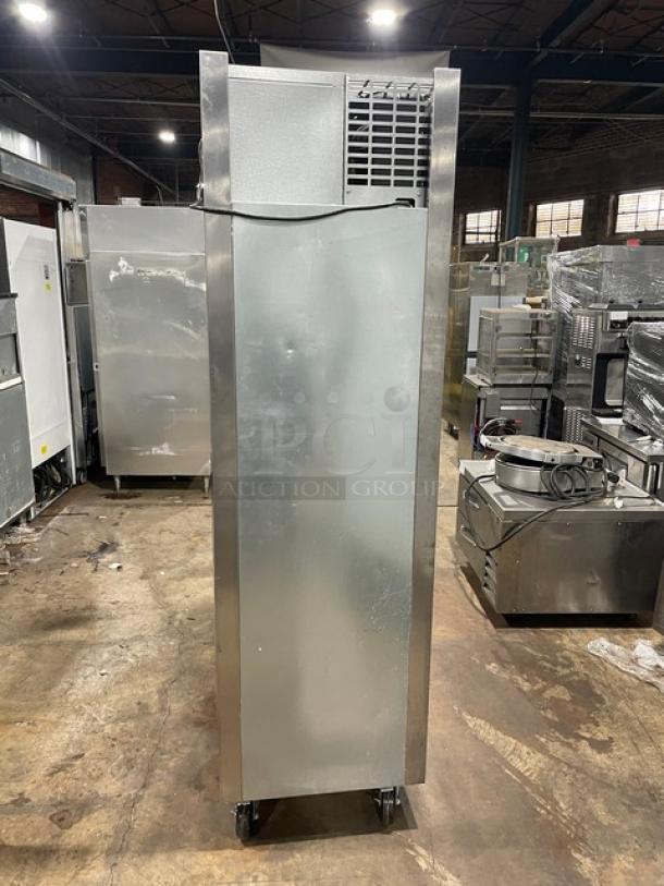 Traulsen AHT132DUT-HHS commercial stainless steel half door refrigerator, with wired racks, on casters. 115V, single phase.