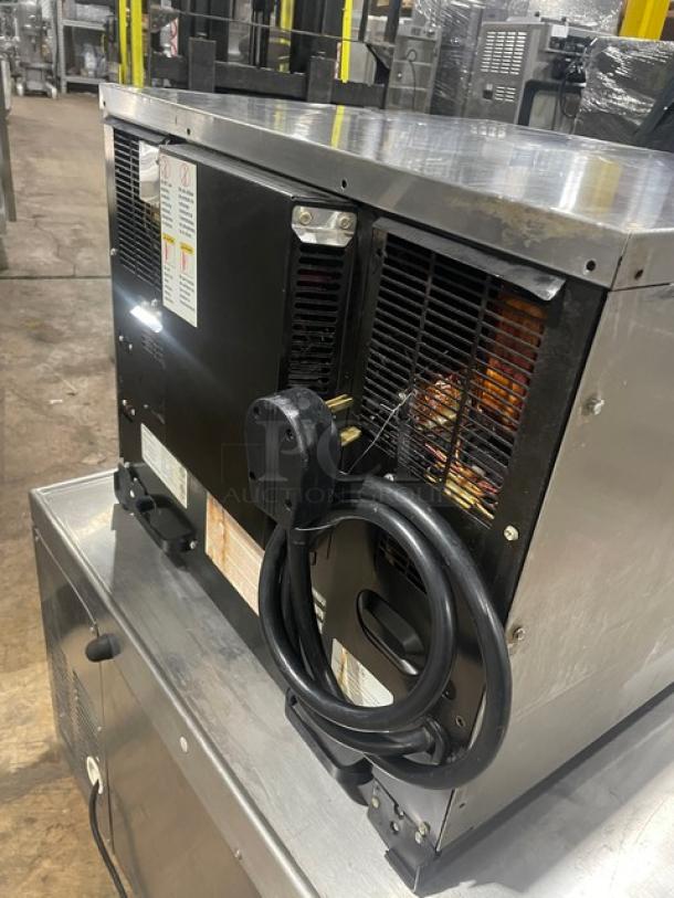 Menu Master MXP22TLT stainless steel convection/microwave oven. Model: MXP22TLT. 208/240V, on legs, power cord visible.