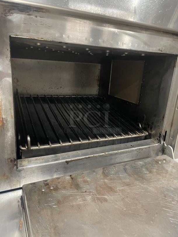 Menu Master MXP22TLT stainless steel convection/microwave oven, 208/240V, countertop model, used condition, on legs.