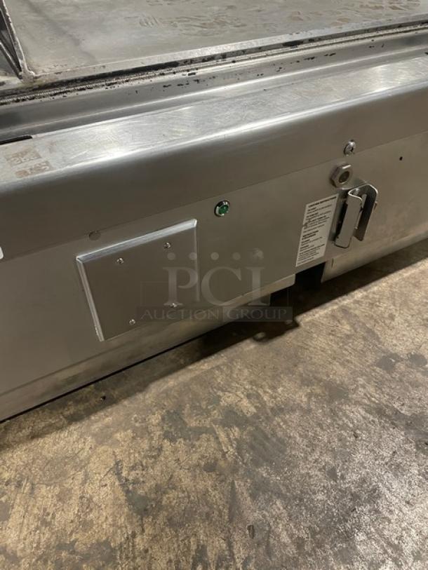 Woodstone stainless steel split-top plancha griddle, Model WS-PL-4836-4-CT00NG, with side and back splash, on legs.