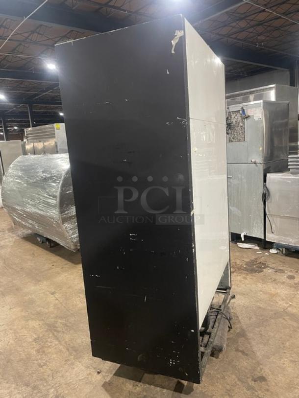 True Commercial Black Double Glass Sliding Door Merchandiser Refrigerator, Model GDM-41, side view, used condition.