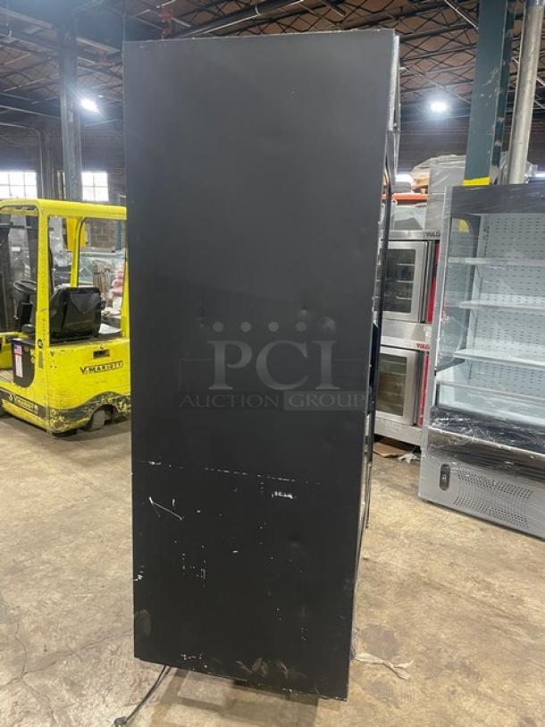 True GDM-41 black double glass door merchandiser refrigerator with pusher glide organizer. Used condition. Model: GDM-41.