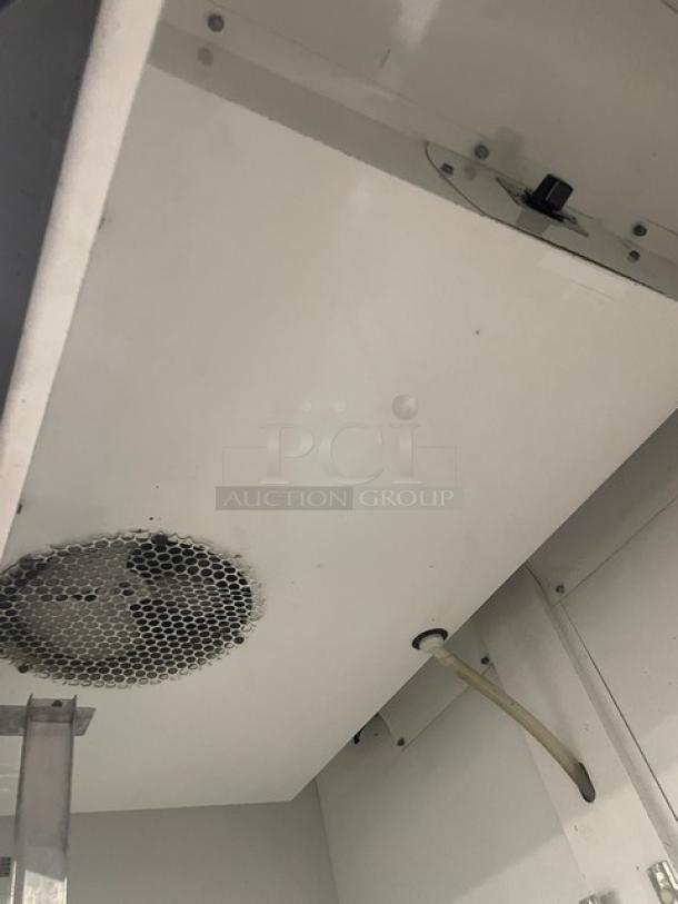 True Commercial Black Double Glass Sliding Door Reach-In Merchandiser Refrigerator. Model GDM-41. Features pusher glide organizer and SN: 570537. 115V 1 Phase. Visible interior detail shown.