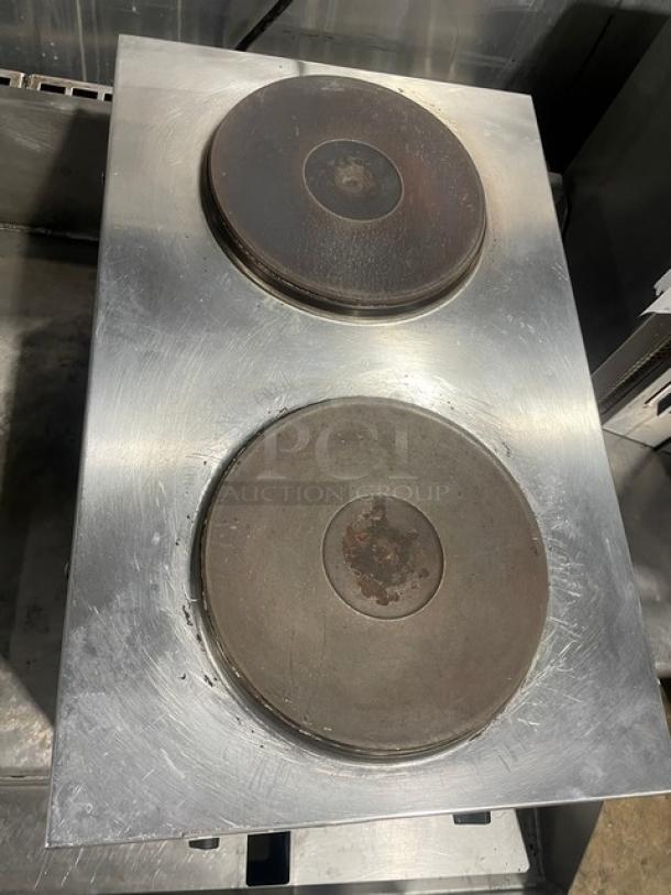 Cecilware stainless steel 2-burner electric hot plate, commercial grade, on legs. Shows signs of use, sturdy design.