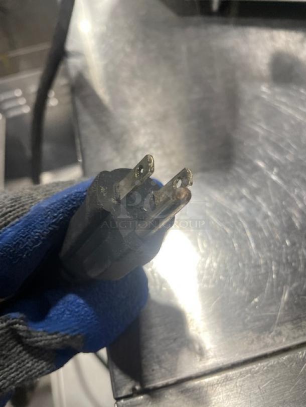 Close-up of a 3-prong plug for Avantco Model 177F100 countertop deep fat fryer, highlighting electrical compatibility.