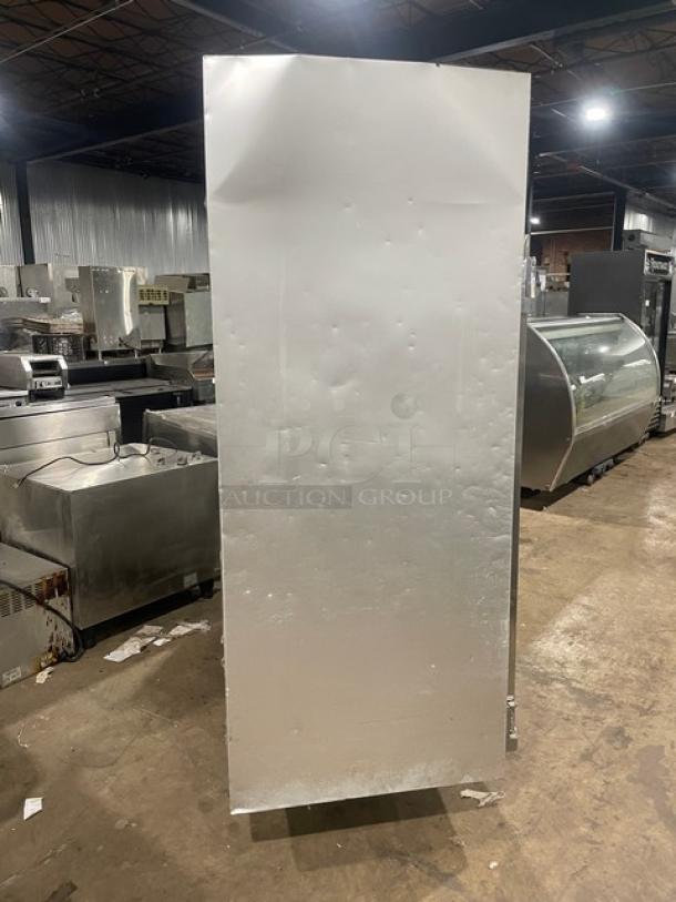 Traulsen stainless steel triple door reach-in freezer, Model G31010, on casters. Solid build, energy-efficient, commercial use.