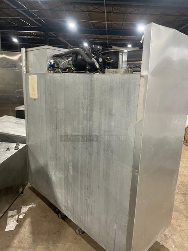 Traulsen triple door reach-in freezer, model G31010, stainless steel, on casters, Energy Star certified, poly-coated rack.