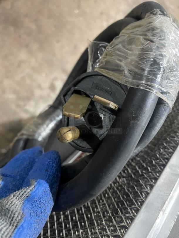 TurboChef NGOD12192 electric cord with plug detail, showcasing its 208/240V compatibility, wrapped in plastic.