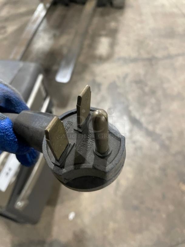 Close-up of a 3-prong electric power plug for a TurboChef NGO model rapid cook oven, indicating 208/240V compatibility.