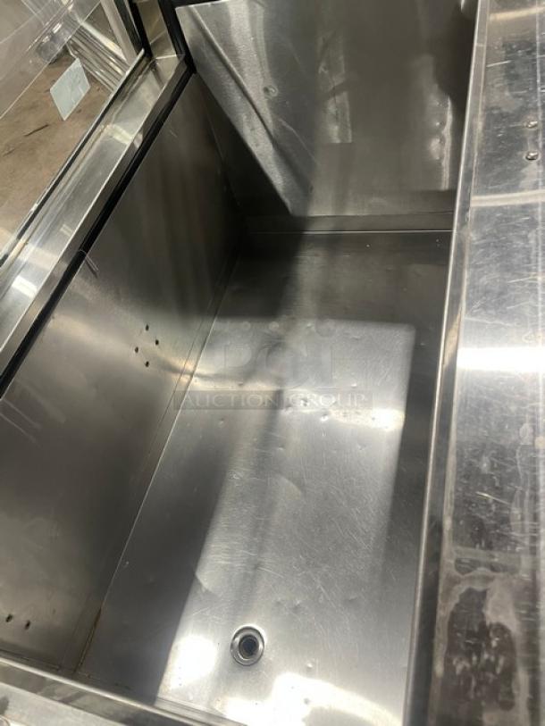 Commercial 46" ice cream dipping cabinet with curved glass, rear lift-open access, stainless steel interior, SN: N1902303.