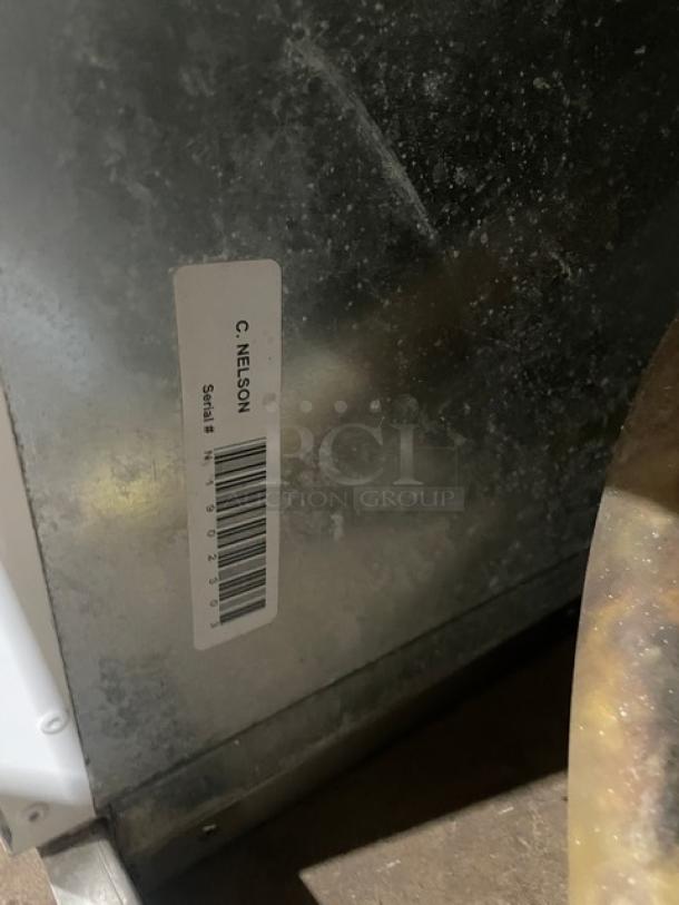 Commercial white curved glass 46" ice cream cabinet, rear lift-open access. Serial number: N1902303. Appears in good condition.