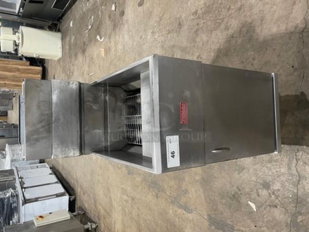 Trialator commercial stainless gas-powered 40lb deep fat fryer with backsplash, on legs. Features a front panel and side handle.