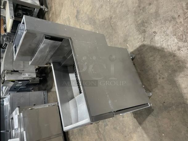 Trialator commercial stainless steel 40lb deep fat fryer with backsplash, gas powered, on legs, clean condition.