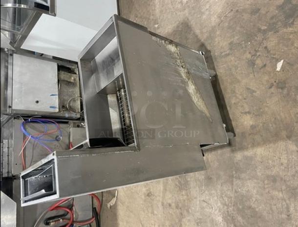 Trialator commercial 40lb. gas deep fryer with backsplash, stainless steel, on legs, visible wear, ideal for catering.