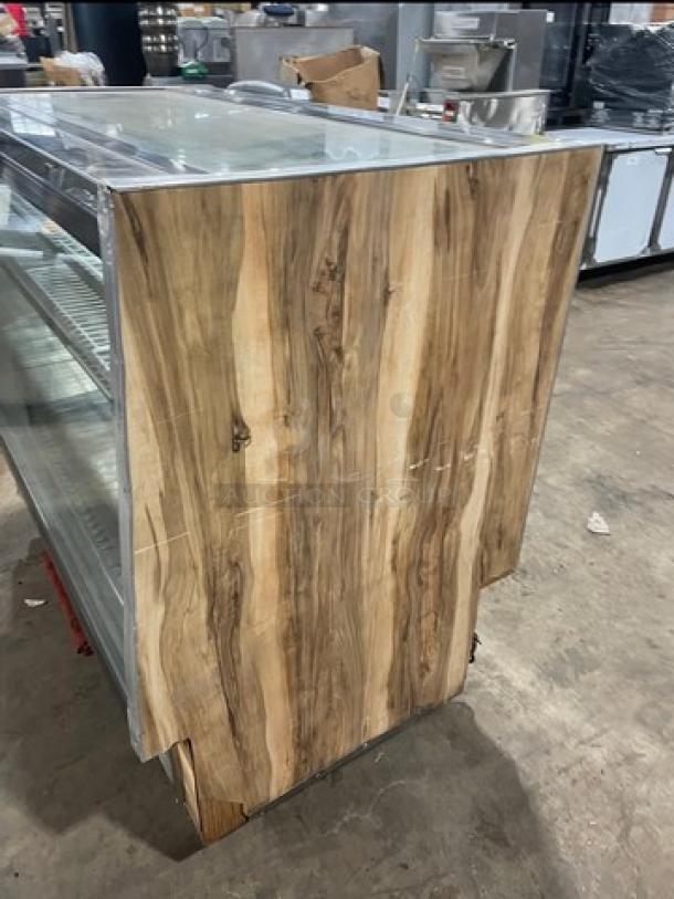 Marc SQBCR59 wooden style bakery display, 59" flat glass, poly coated wire rack, rear sliding doors, 115V, used condition.