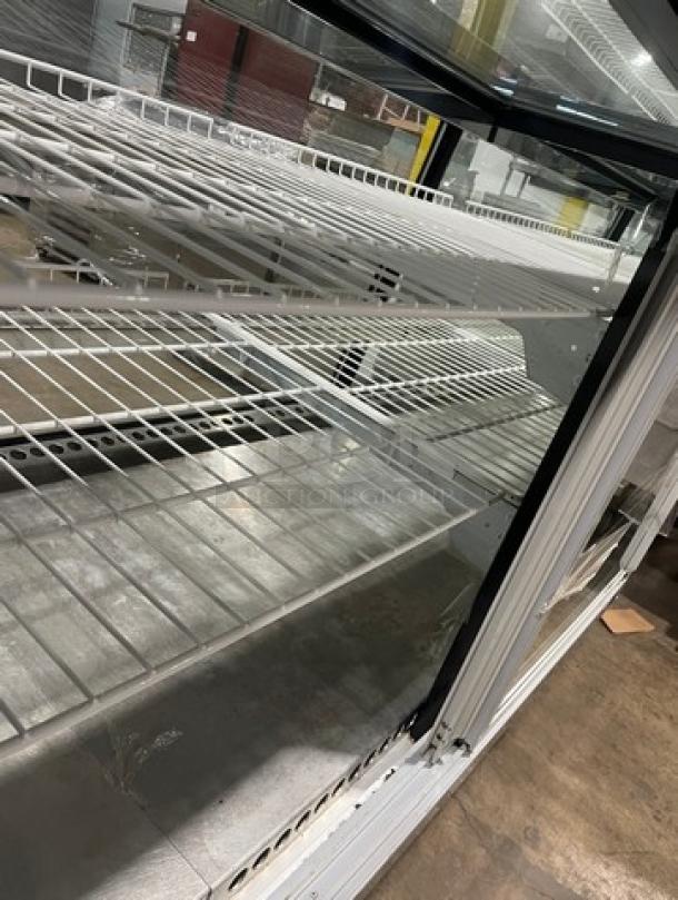 Marc SQBCR59 59" flat glass bakery display case with poly-coated racks, rear sliding glass doors; 115V 1 Phase, SN: 130615.