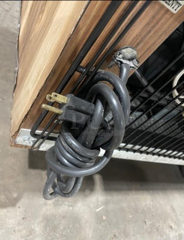 Marc SQBCR-59 glass refrigerated bakery display case, 59", wooden style, poly-coated wire rack, rear sliding glass doors.