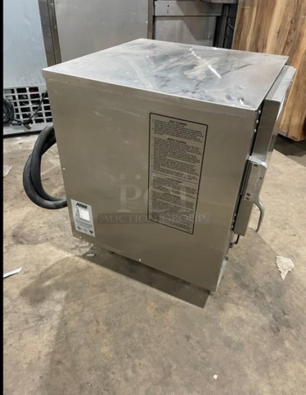 AccuTemp Evolution Series stainless steel convection steamer, model E62083E15000250, electric, 6-pan capacity, on legs.